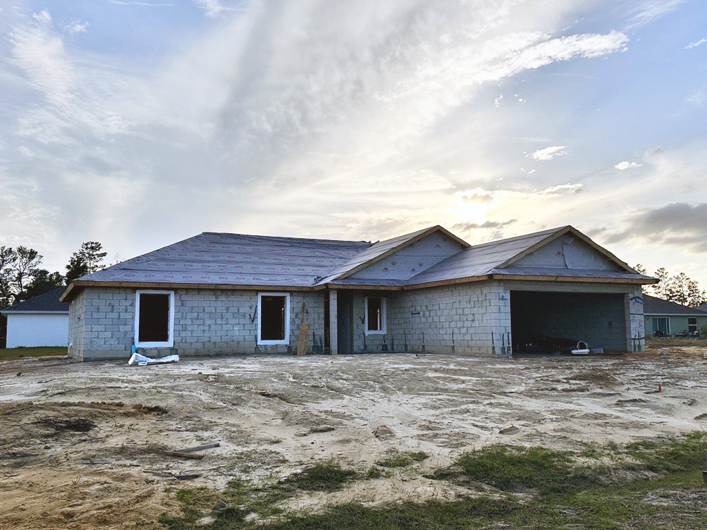 concrete block home being built in Florida neighborhood